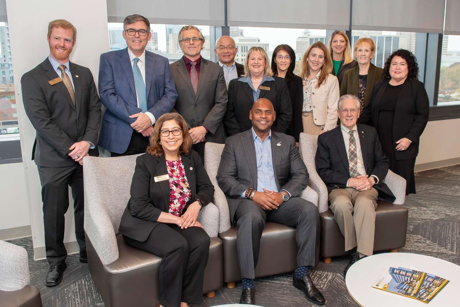 Seated with Conley at his left is Mick, faculty emeritus and former chair of the Department of Health Administration.